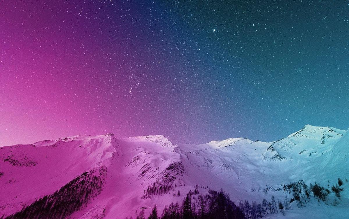 mountains with a pink to light blue gradient overlay